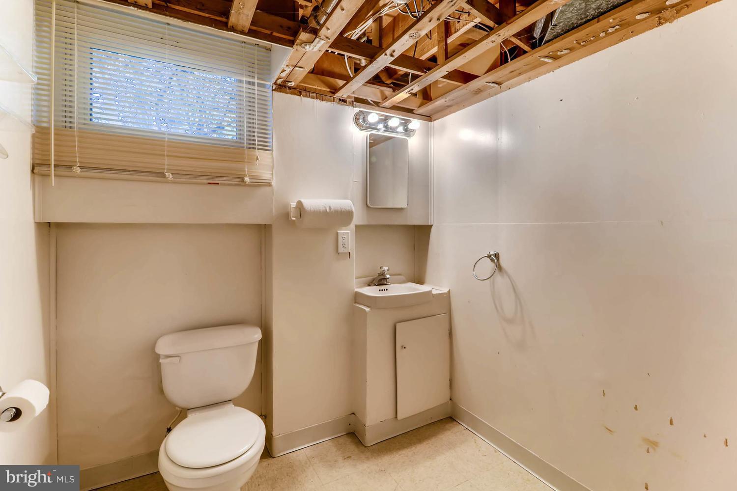 3663 Clifmar Road Baltimore, MD 21244 - Photo 22 of 25 a bathroom with a toilet and a sink