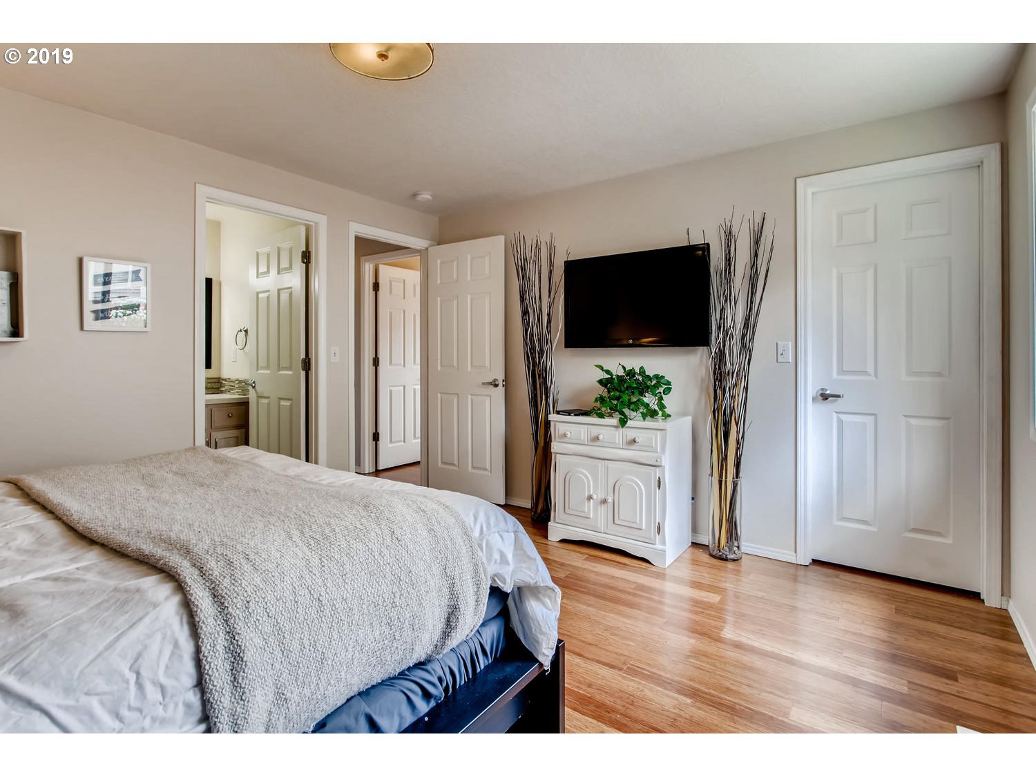 11578 Parrish Road Oregon City, OR 97045 - Photo 12 of 22 a bedroom with a bed and a flat screen tv