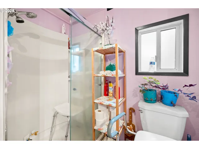 a bathroom with a sink mirror vanity and toilet