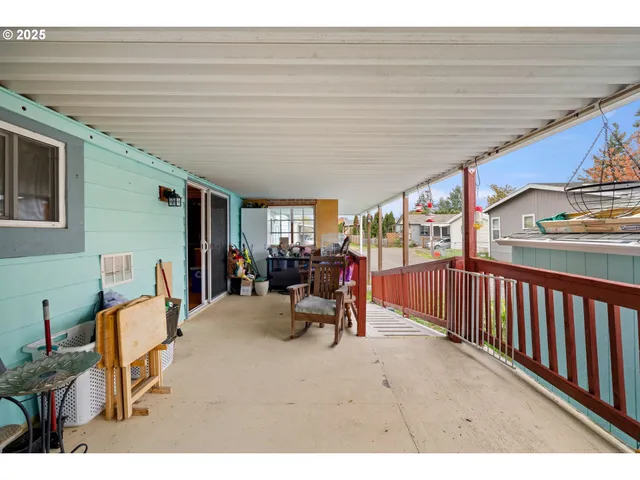 a view of a patio with table and chairs