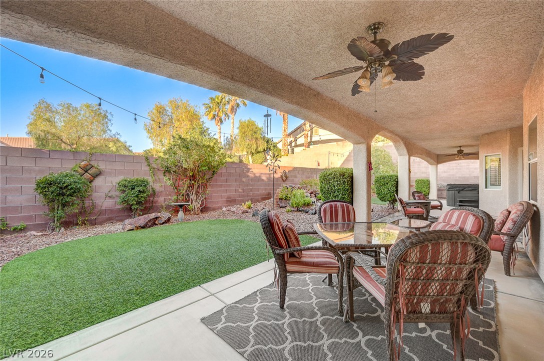 1604 Cattle Ranch Place Henderson, NV 89002 - Photo 67 of 99 An inviting covered patio offers an ideal space for outdoor relaxation and entertainment.