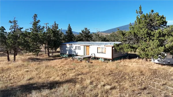 a house with trees in the background