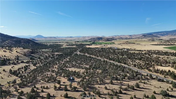 an aerial view of mountain with beach
