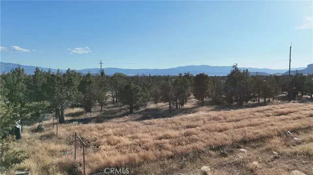 a view of a road with a building in the background