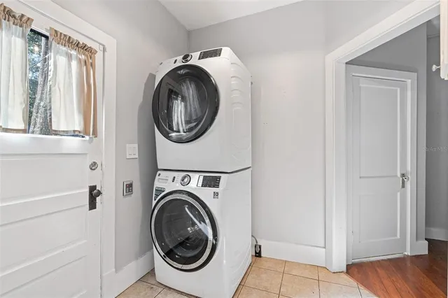 a view of a hallway with washer and dryer