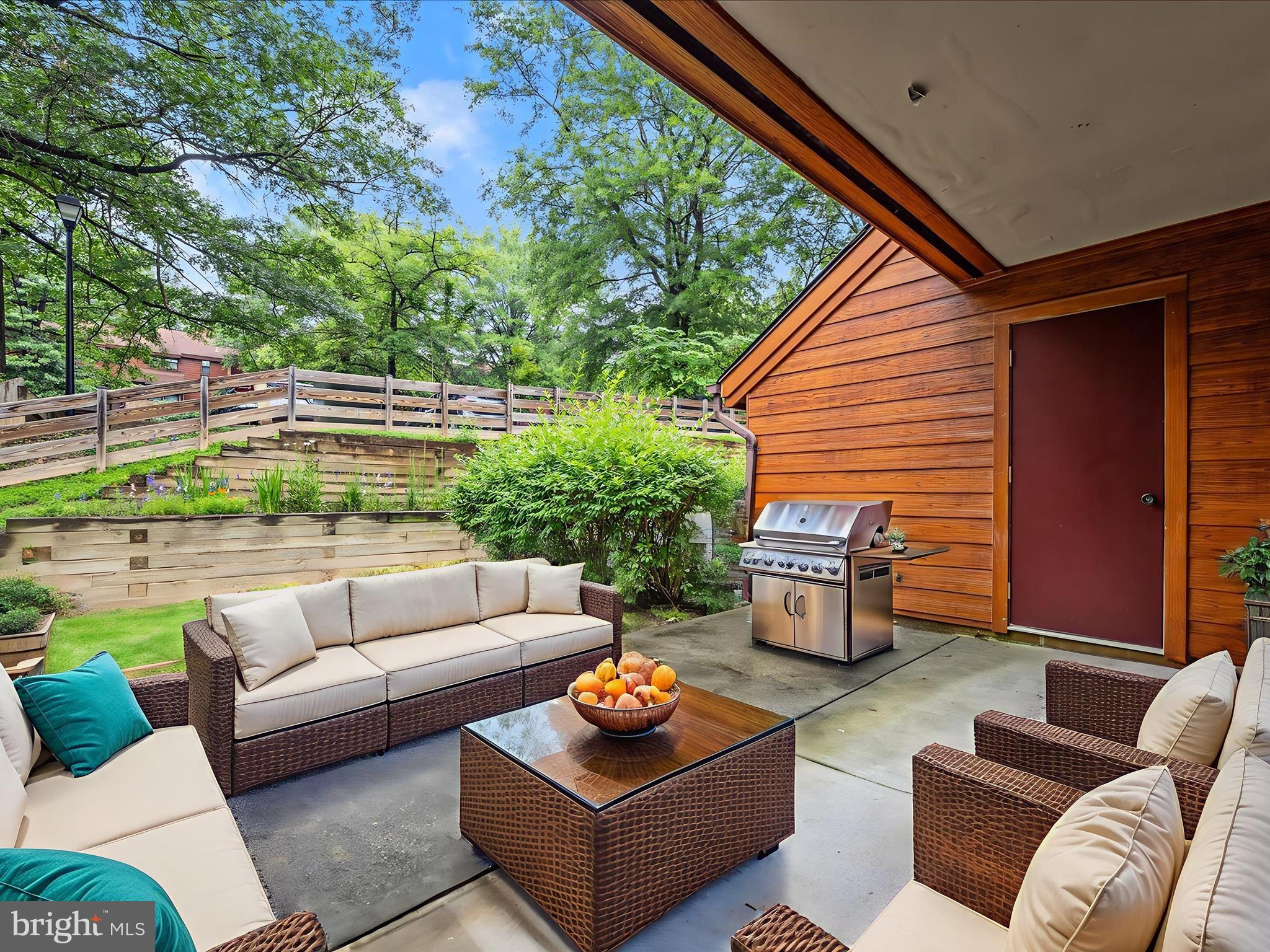 7607 Weather Worn Way, Unit A Columbia, MD 21046 - Photo 2 of 36 a outdoor living space with furniture and a potted plant