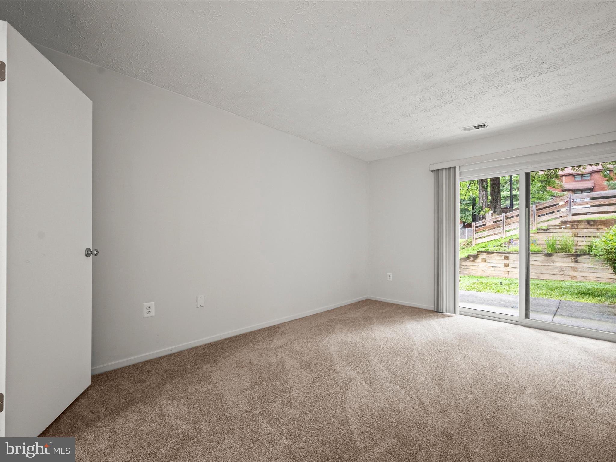 7607 Weather Worn Way, Unit A Columbia, MD 21046 - Photo 22 of 36 a view of an empty room with a window