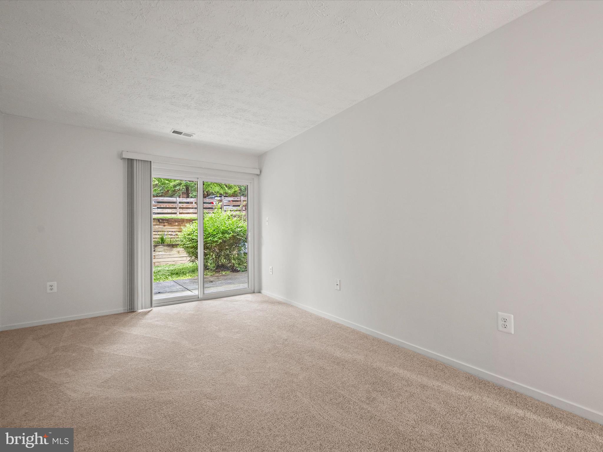 7607 Weather Worn Way, Unit A Columbia, MD 21046 - Photo 23 of 36 a view of an empty room with a window