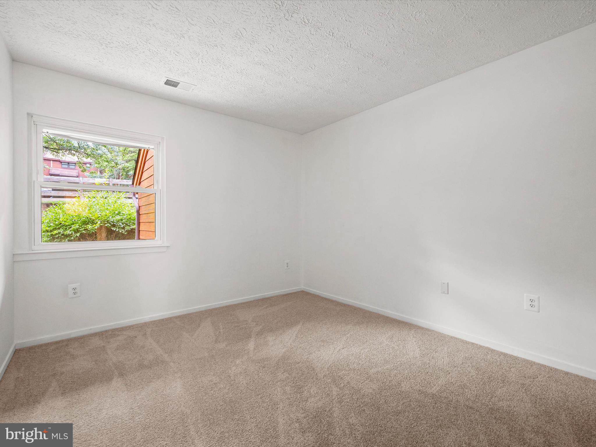 7607 Weather Worn Way, Unit A Columbia, MD 21046 - Photo 27 of 36 an empty room with a window