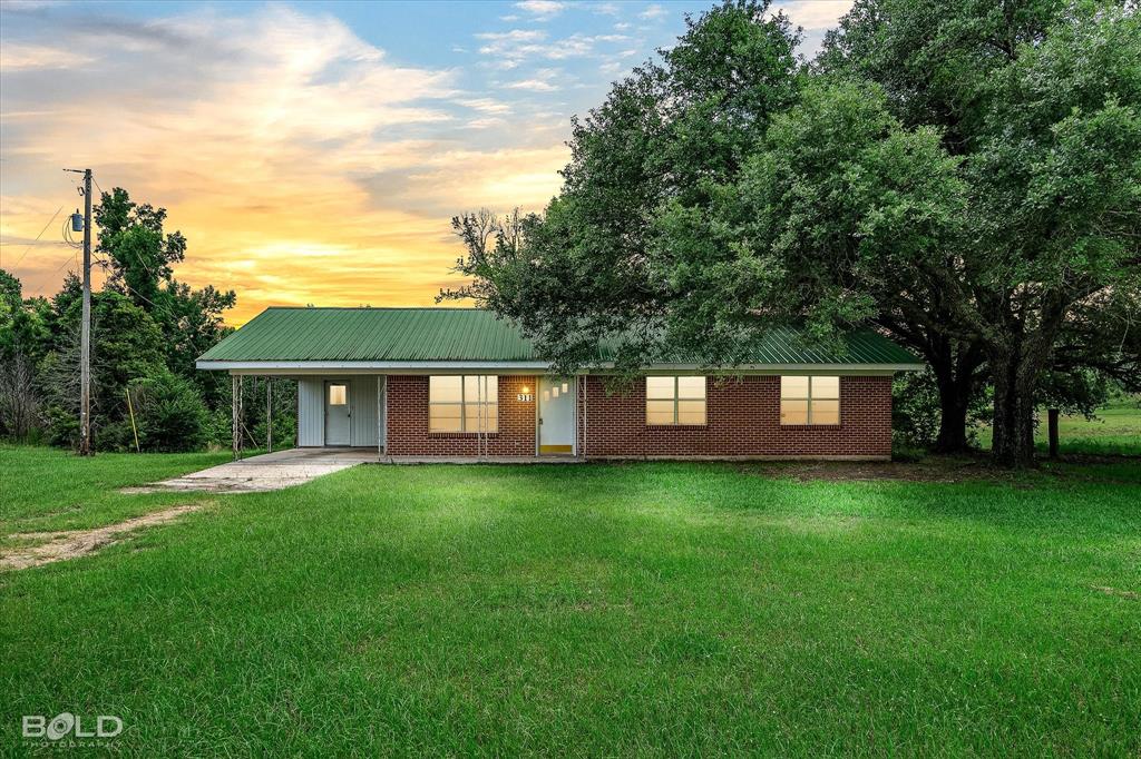 311 Rawls Road Coushatta, LA 71019 - Photo 1 of 1 a view of a house with a big yard