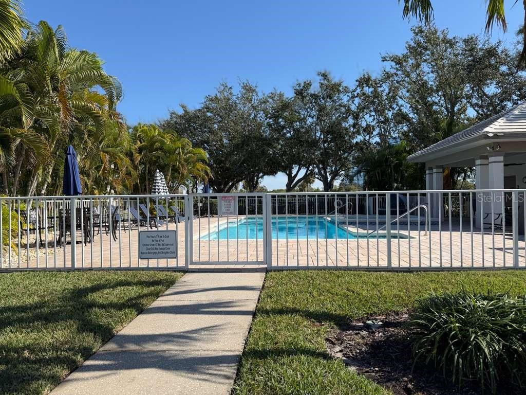 13606 Eagles Walk Drive Clearwater, FL 33762 - Photo 27 of 28 a view of a deck with a white fence