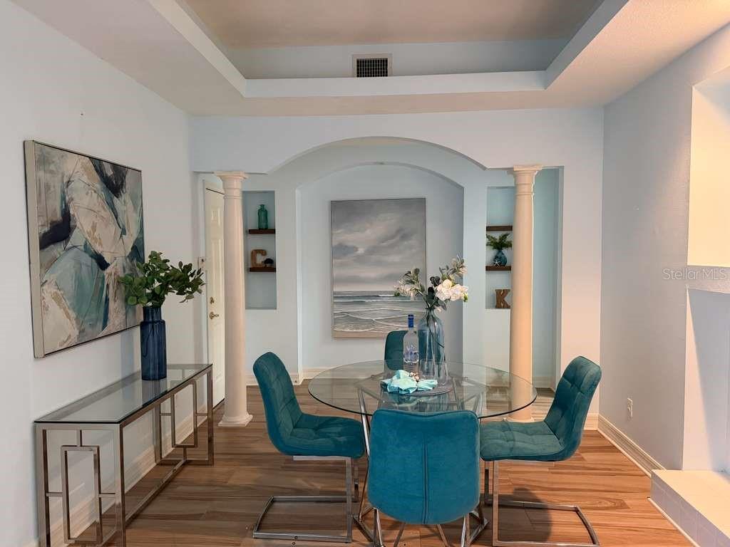 13606 Eagles Walk Drive Clearwater, FL 33762 - Photo 5 of 28 a dining room with furniture and wooden floor