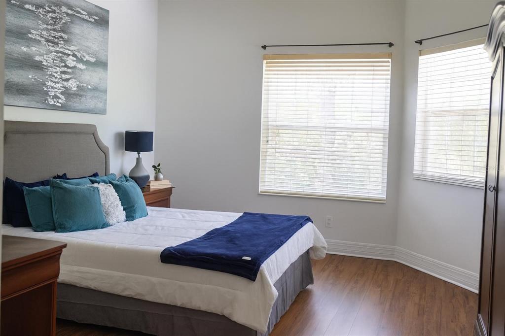 13606 Eagles Walk Drive Clearwater, FL 33762 - Photo 8 of 28 a bedroom with a bed and wooden floor
