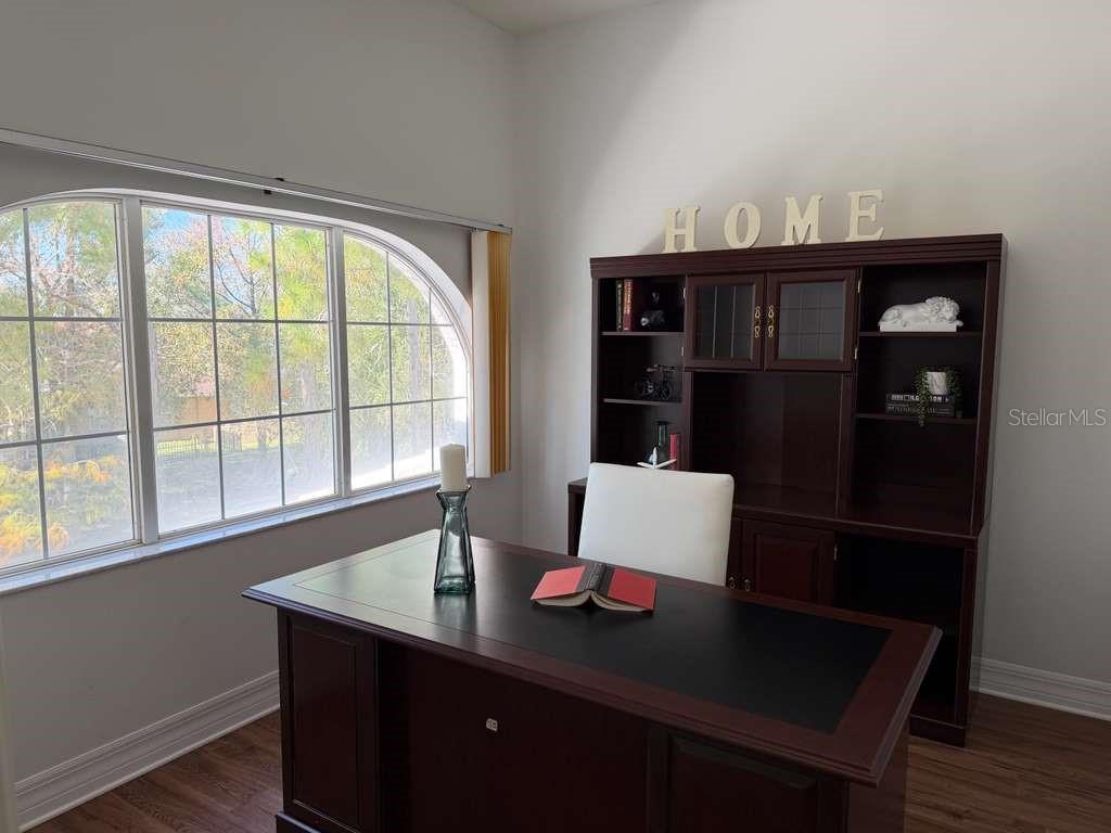 13606 Eagles Walk Drive Clearwater, FL 33762 - Photo 10 of 28 a living room with a table and a window