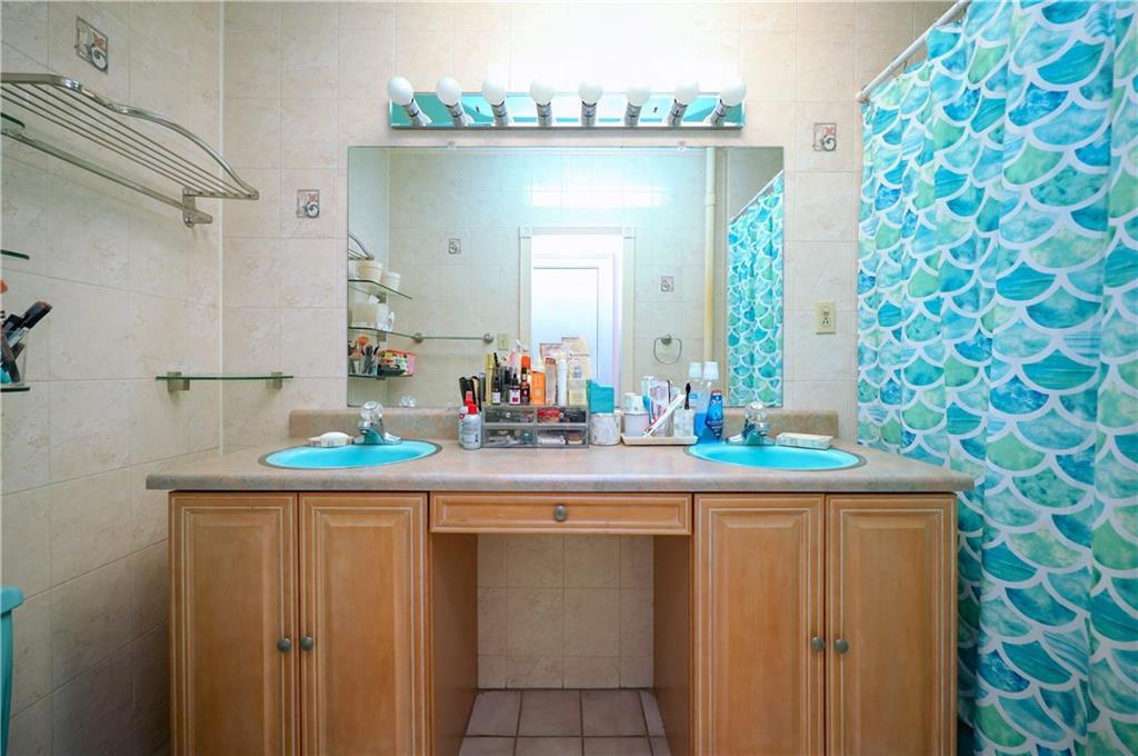 578 Ovington Avenue Brooklyn, NY 11209 - Photo 15 of 40 a kitchen with a sink and cabinets