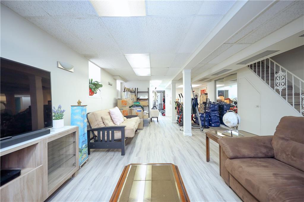 578 Ovington Avenue Brooklyn, NY 11209 - Photo 26 of 40 a living room with furniture and a flat screen tv