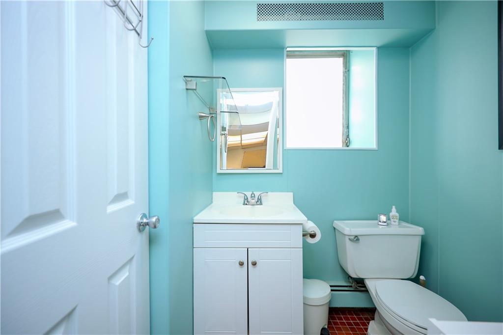 578 Ovington Avenue Brooklyn, NY 11209 - Photo 29 of 40 a bathroom with a toilet sink and mirror