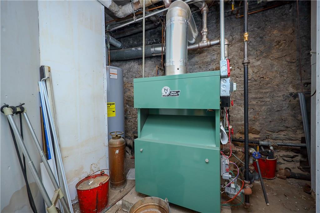578 Ovington Avenue Brooklyn, NY 11209 - Photo 30 of 40 a bathroom with a toilet and a shower