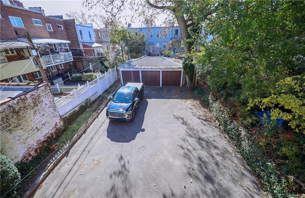 578 Ovington Avenue Brooklyn, NY 11209 - Photo 35 of 40 a view of a chairs and table in the backyard