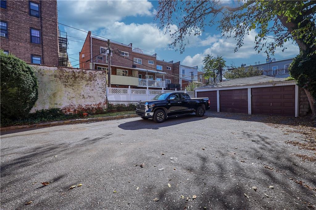 578 Ovington Avenue Brooklyn, NY 11209 - Photo 4 of 40 a car parked in front of a brick house