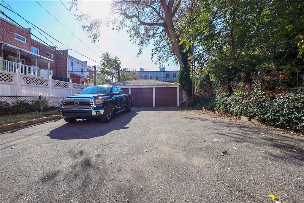 578 Ovington Avenue Brooklyn, NY 11209 - Photo 6 of 40 a car parked in front of a brick house