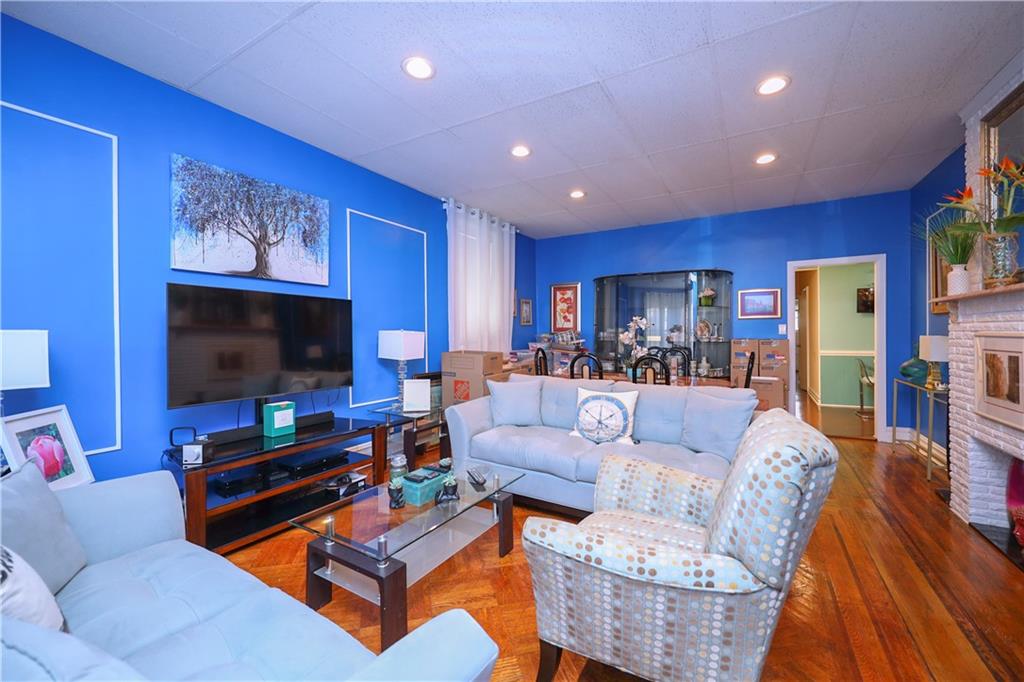 578 Ovington Avenue Brooklyn, NY 11209 - Photo 8 of 40 a living room with furniture and a flat screen tv
