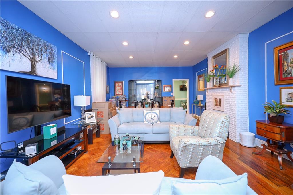 578 Ovington Avenue Brooklyn, NY 11209 - Photo 9 of 40 a living room with fireplace furniture and a flat screen tv