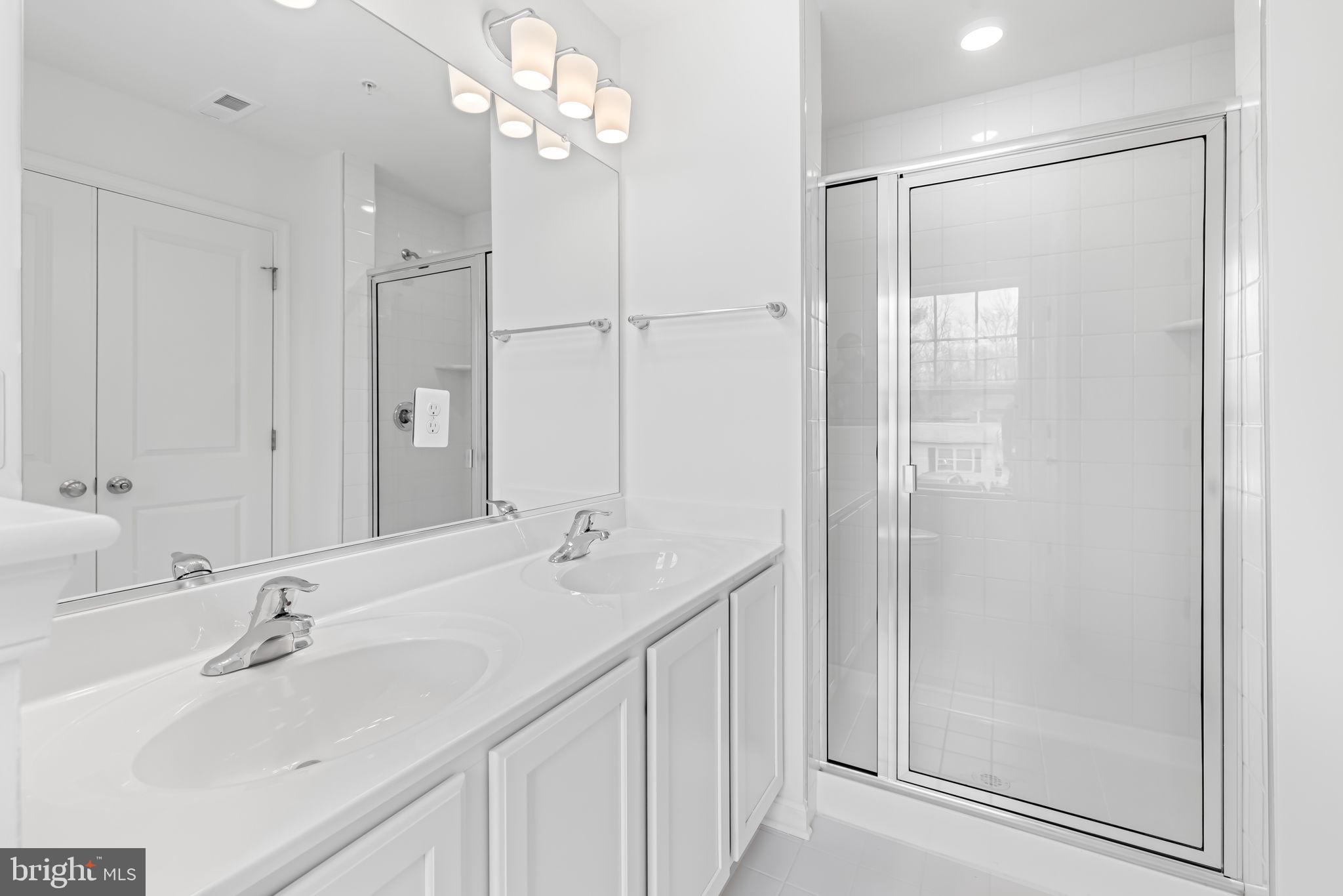 2115 Nuttal Avenue Edgewood, MD 21040 - Photo 14 of 23 a bathroom with a double vanity sink mirror and shower