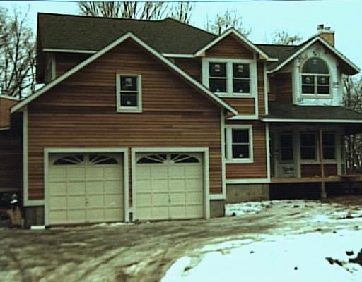 1135 Mill Plain Road Fairfield, CT 06824 - Photo 1 of 1 a front view of a house with a yard