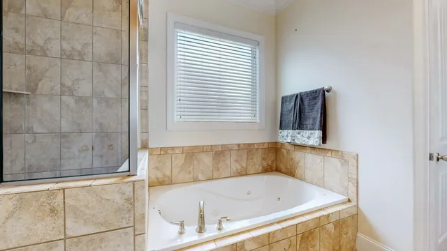 a bathroom with a shower curtain and a shower curtain