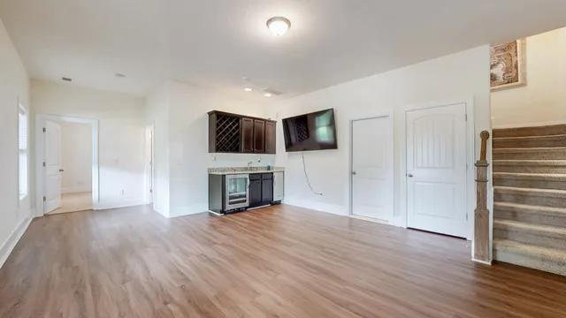a view of a house with a yard patio and a small yard