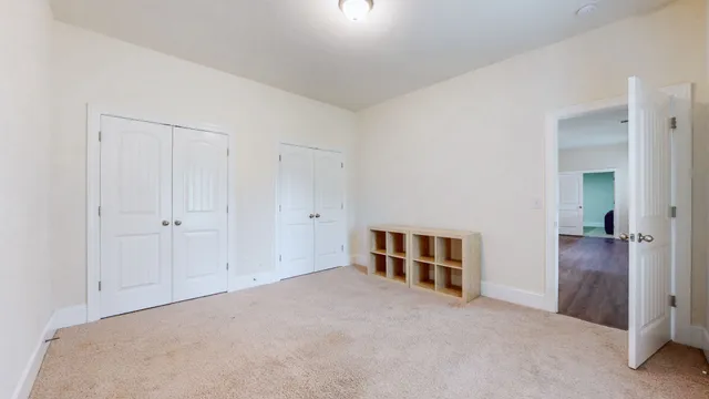 an aerial view of a house with outdoor space and lake view