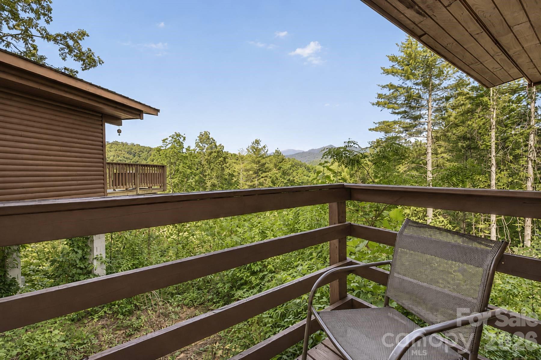 319 Blue Ridge Parkway, Unit 53 Bryson City, NC 28713 - Photo 20 of 22 a view of a two chair in the balcony
