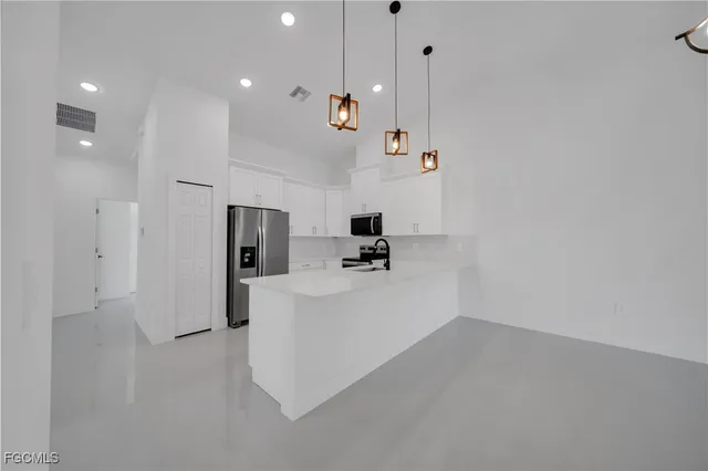 a view of kitchen and living room