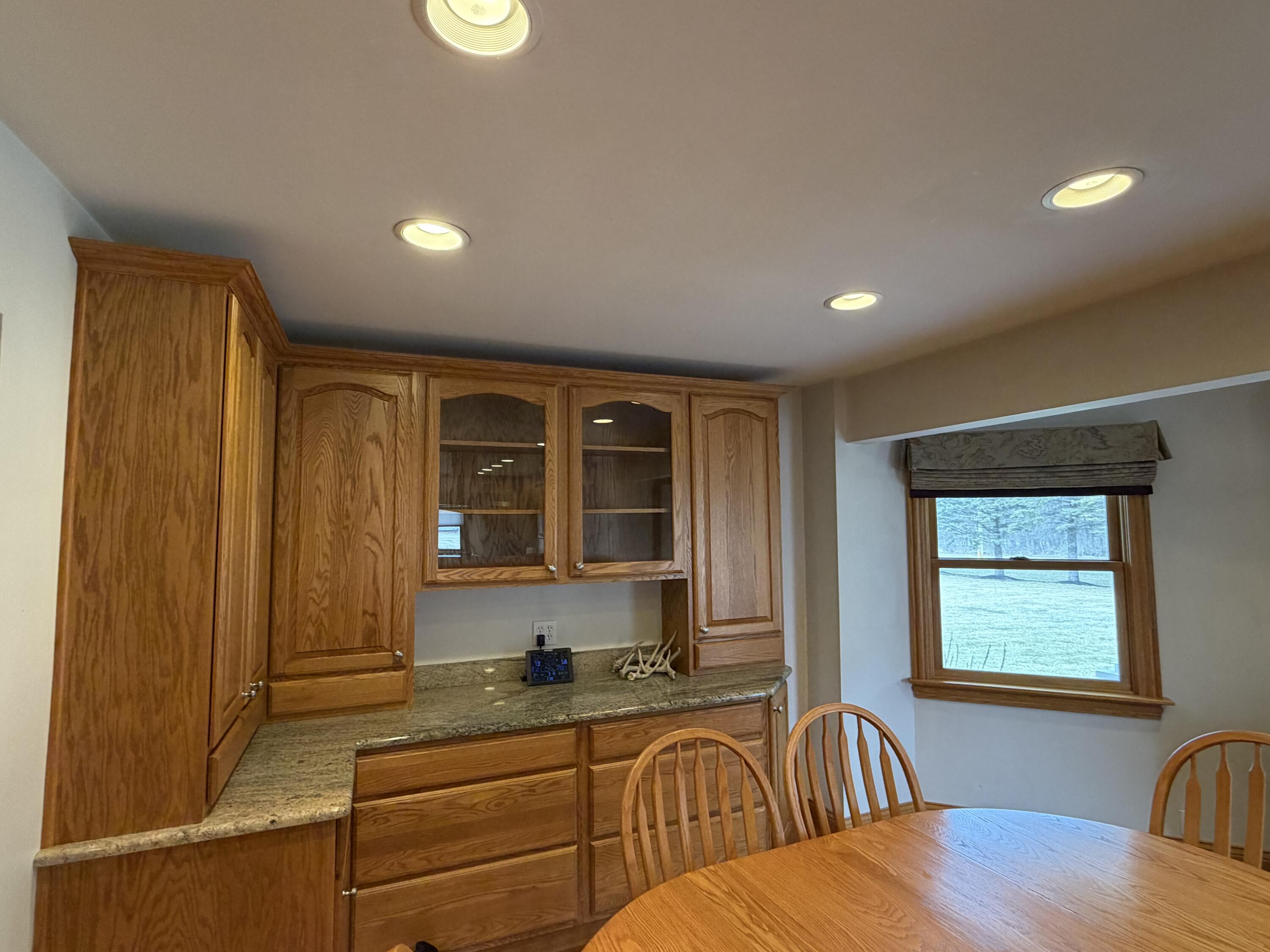 1245 West Mt Calvary Road Rensselaer, IN 47978 - Photo 11 of 35 a kitchen that has a sink and chairs