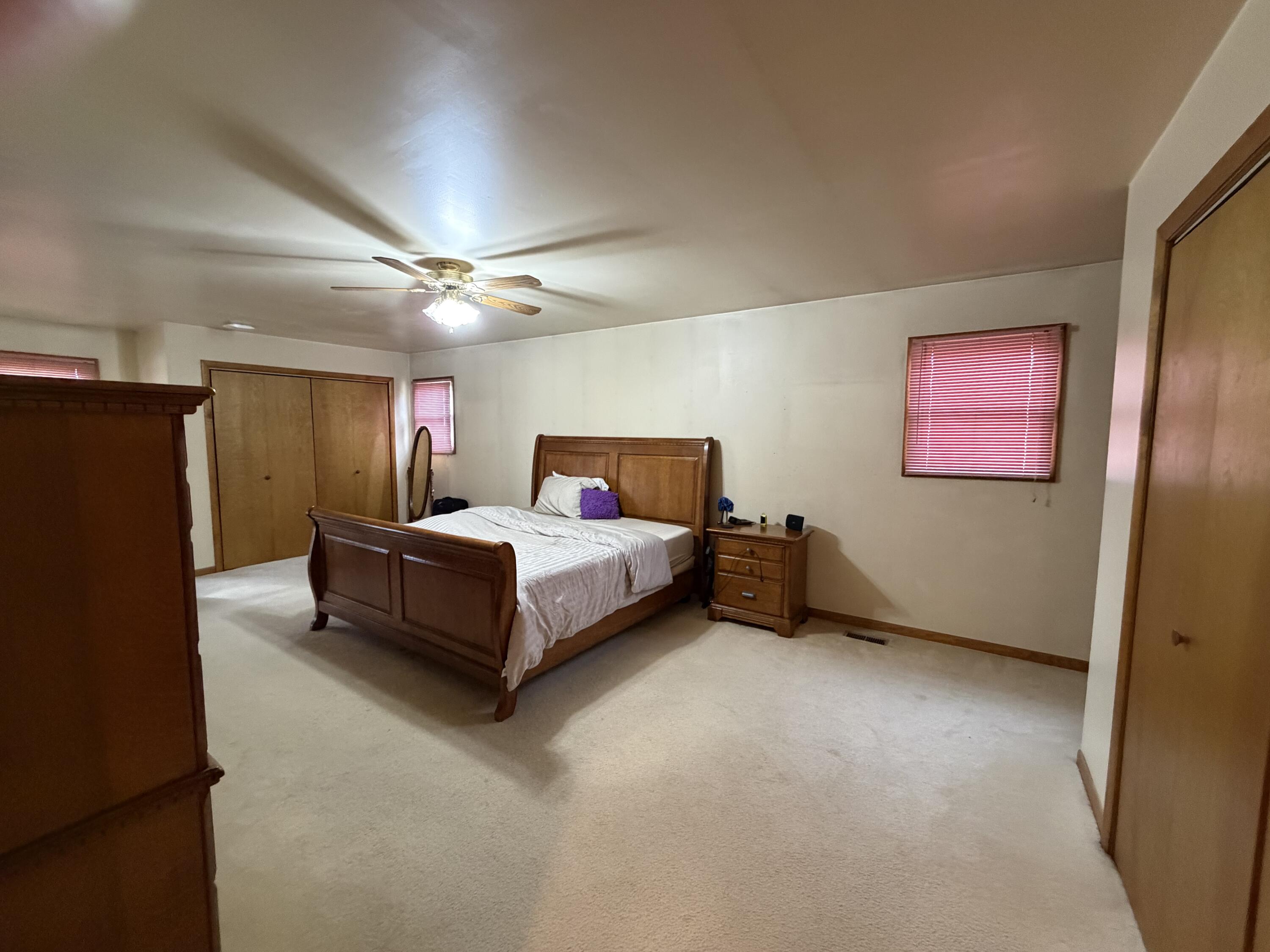 1245 West Mt Calvary Road Rensselaer, IN 47978 - Photo 15 of 35 a bedroom with a bed and a refrigerator