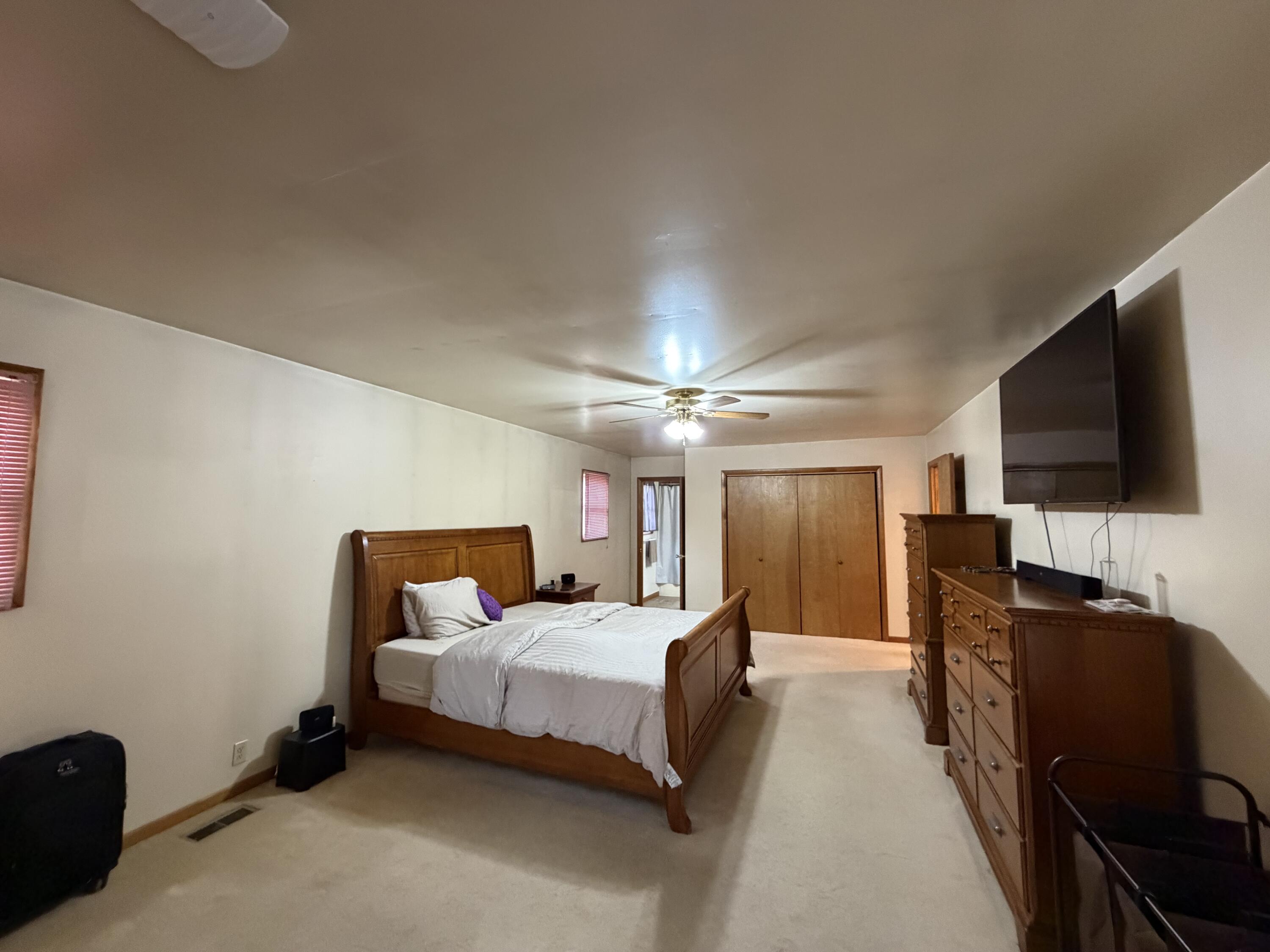 1245 West Mt Calvary Road Rensselaer, IN 47978 - Photo 17 of 35 a bedroom with a bed and a flat screen tv