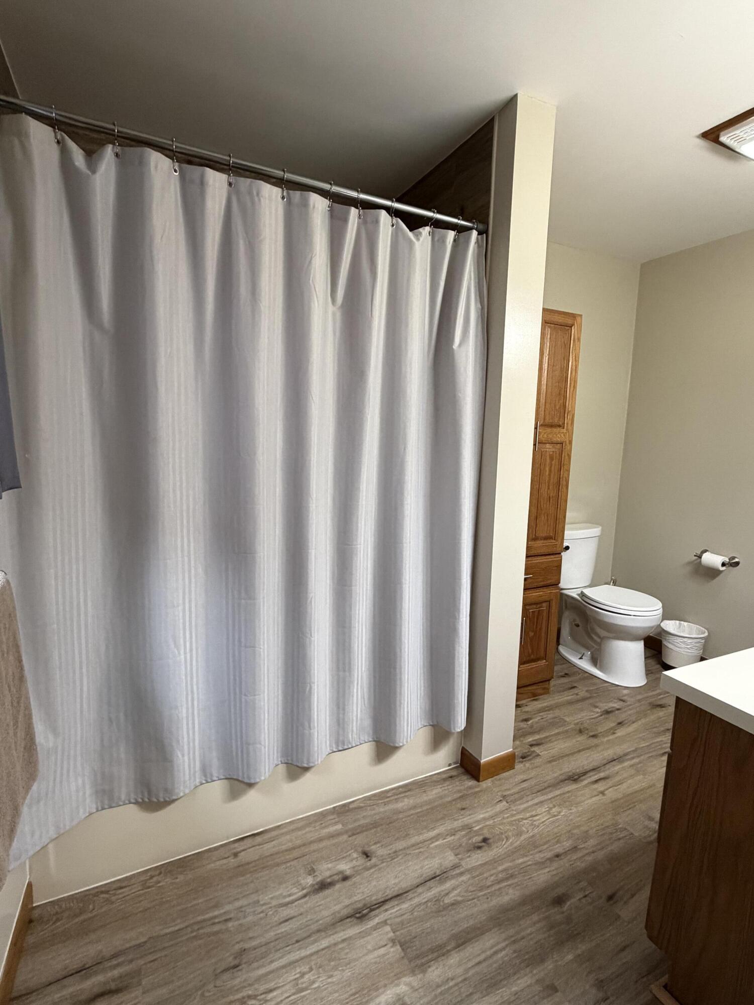 1245 West Mt Calvary Road Rensselaer, IN 47978 - Photo 18 of 35 a view of a room with wooden floor and curtain