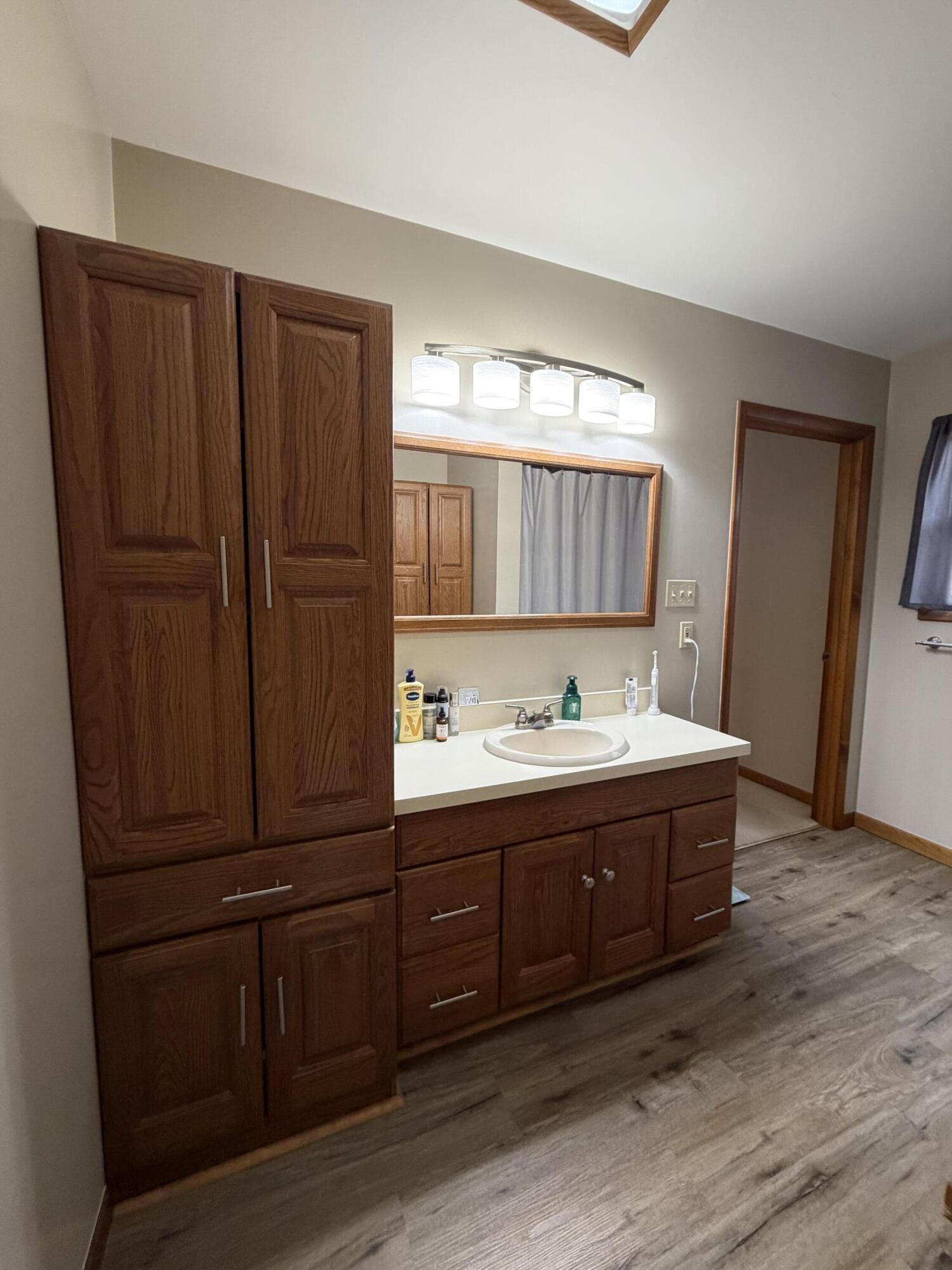 1245 West Mt Calvary Road Rensselaer, IN 47978 - Photo 19 of 35 a bathroom with a sink and a mirror