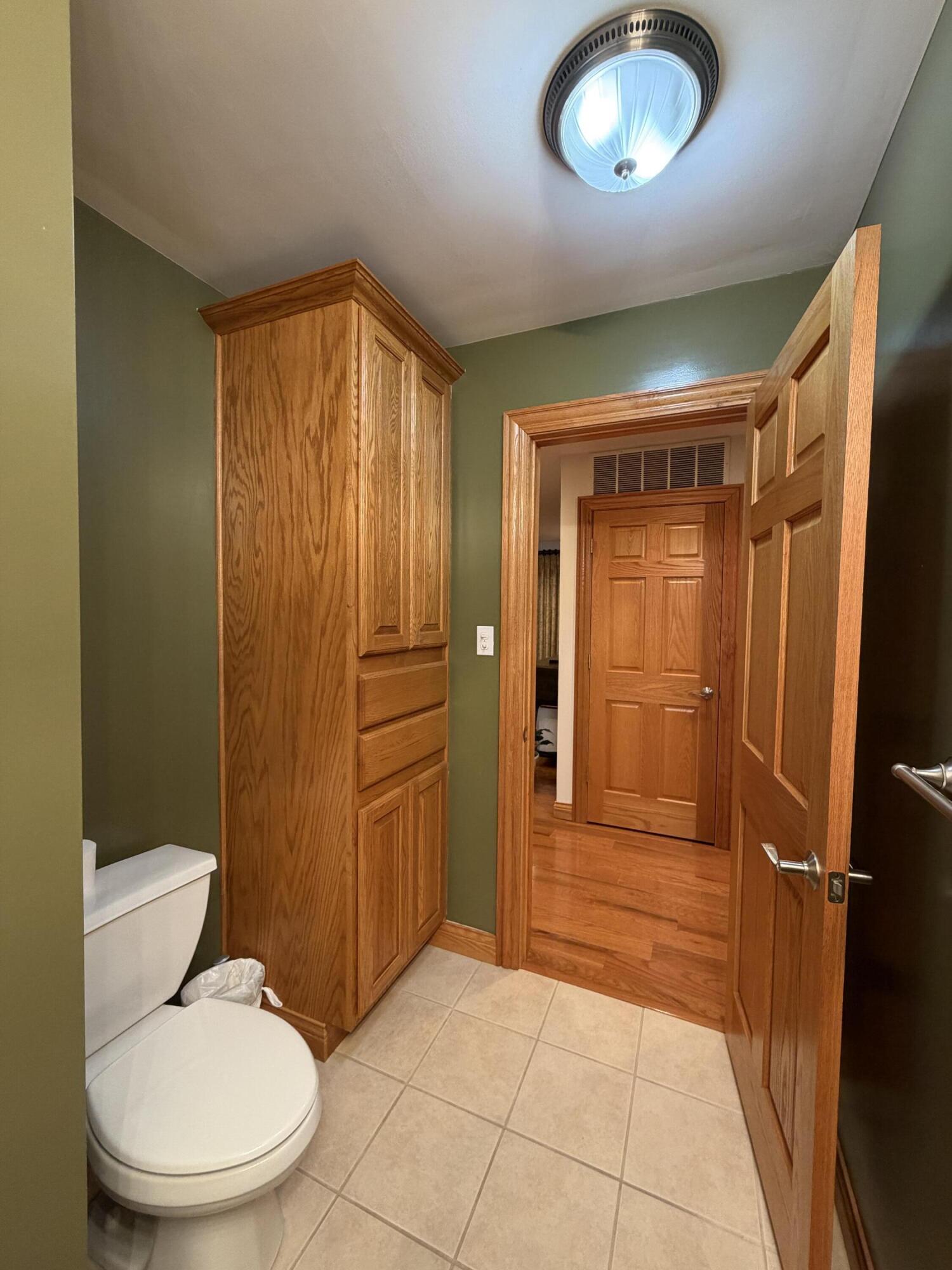 1245 West Mt Calvary Road Rensselaer, IN 47978 - Photo 24 of 35 a bathroom with a granite countertop toilet sink and shower