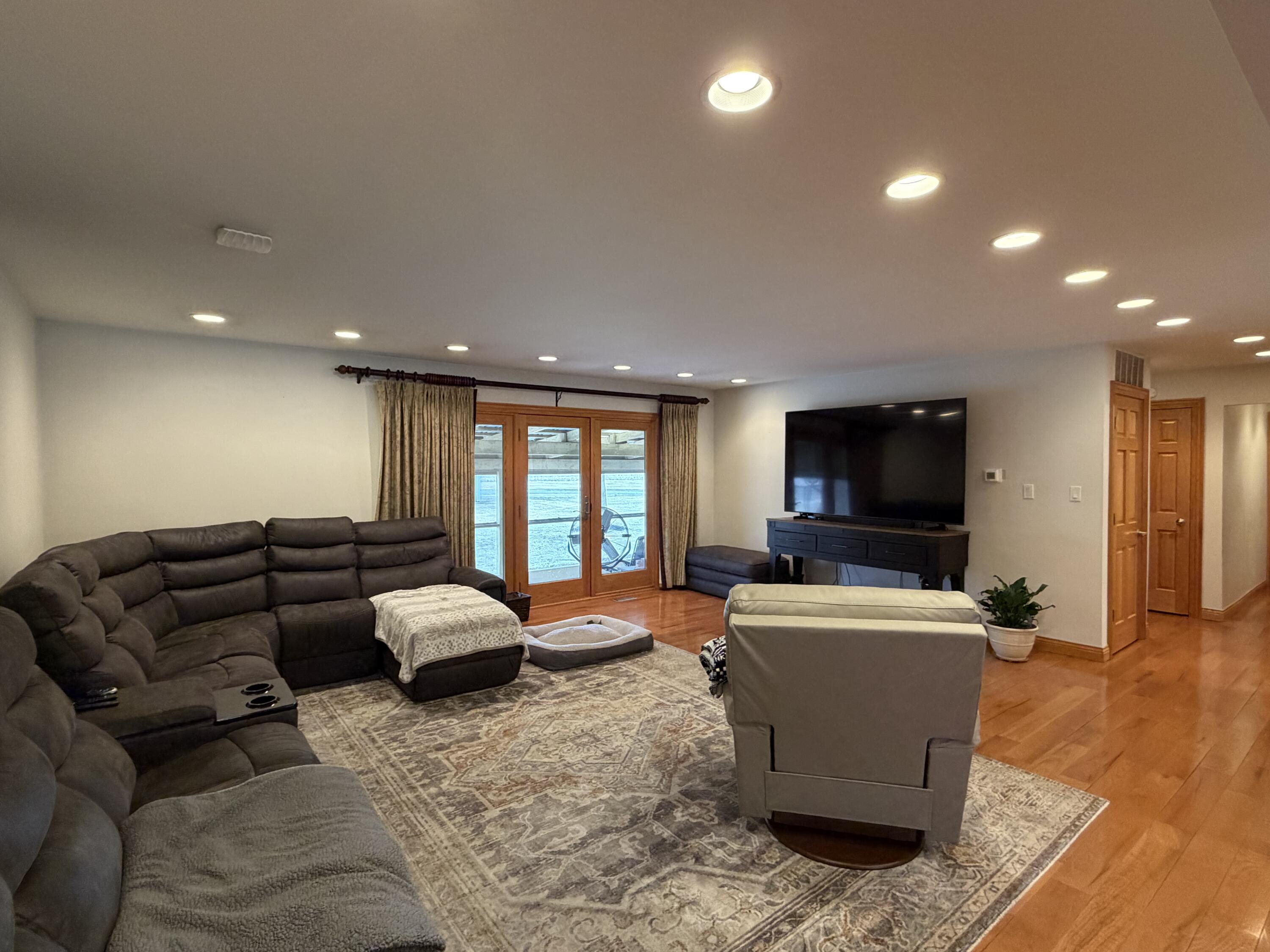 1245 West Mt Calvary Road Rensselaer, IN 47978 - Photo 8 of 35 a living room with furniture and a flat screen tv