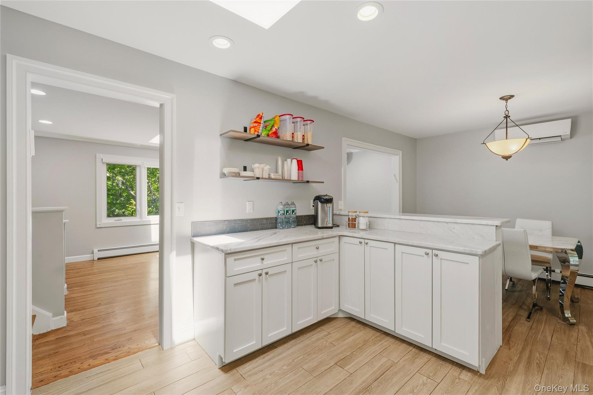 44 Sayer Road Blooming Grove, NY 10914 - Photo 11 of 39 a kitchen with a sink cabinets and wooden floor