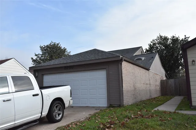 a view of car parked in front of house