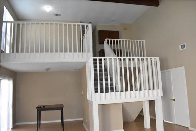 a view of a hallway with staircase