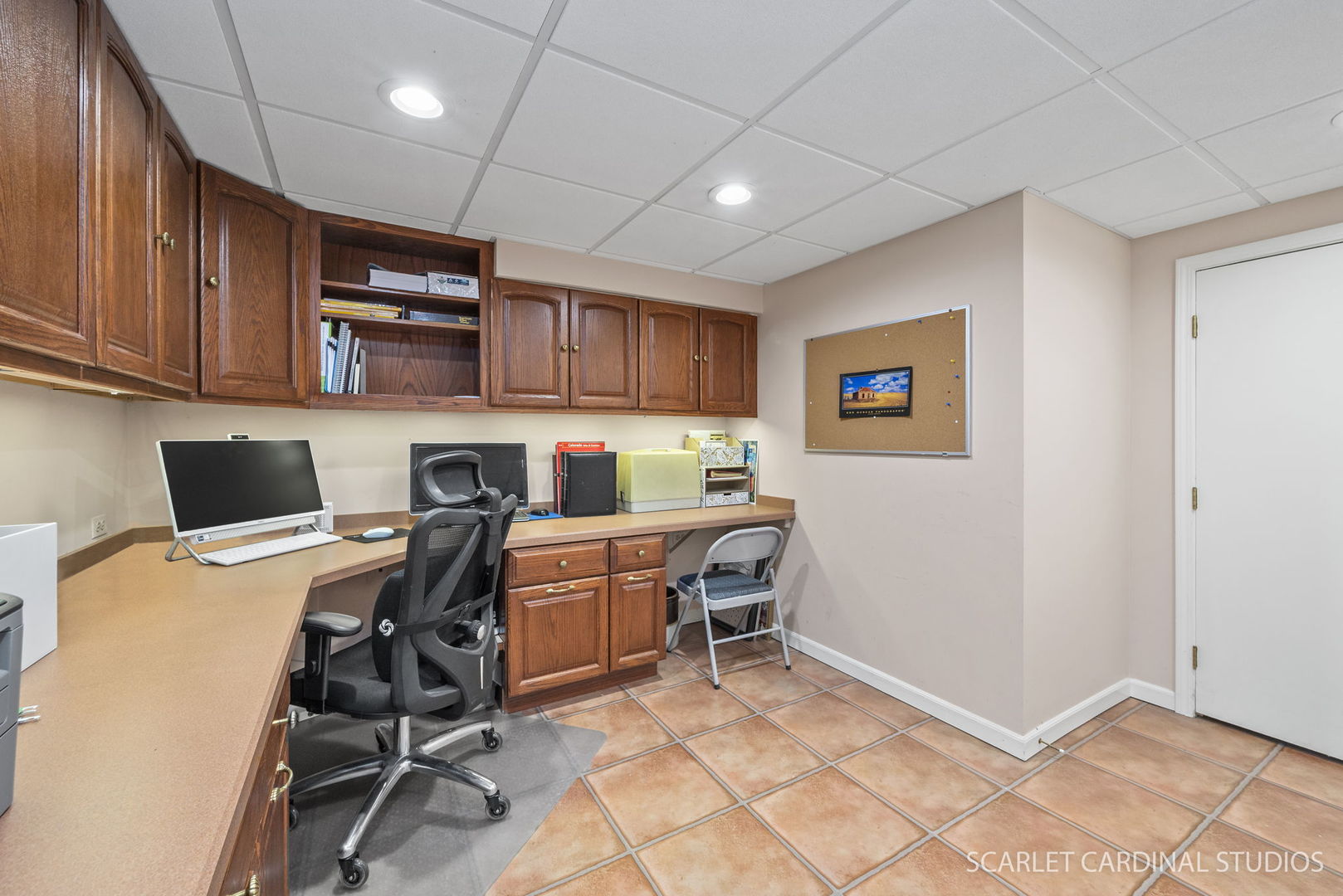 188 Hamilton Lane Wheaton, IL 60189 - Photo 27 of 34 a workspace with a computer on a desk chair and a refrigerator