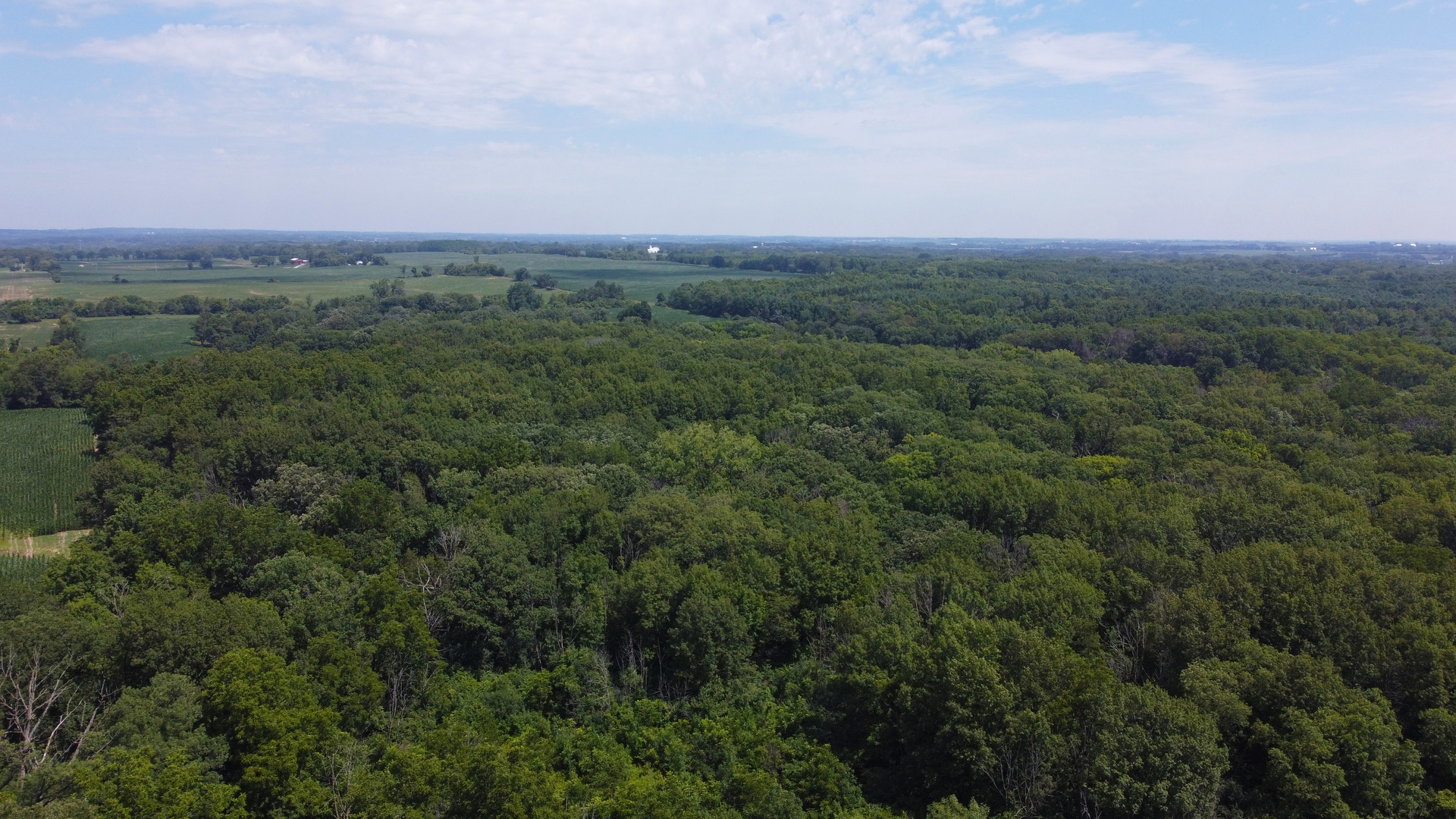 40.75-acres Route 14 Harvard, IL 60033 - Photo 4 of 11 an aerial view of a city and mountain view in back