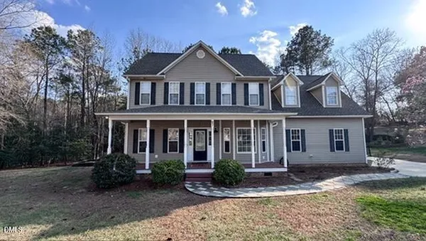 front view of a house with a yard