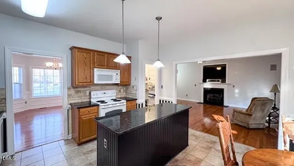 a kitchen with stainless steel appliances granite countertop a sink and cabinets