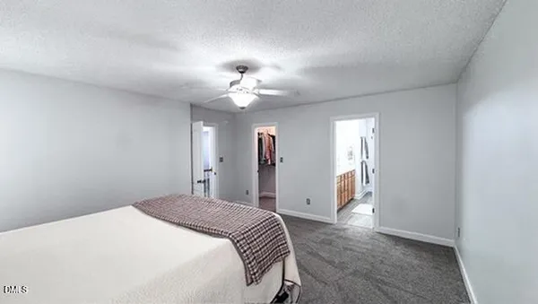 a spacious bathroom with a sink shower and a mirror