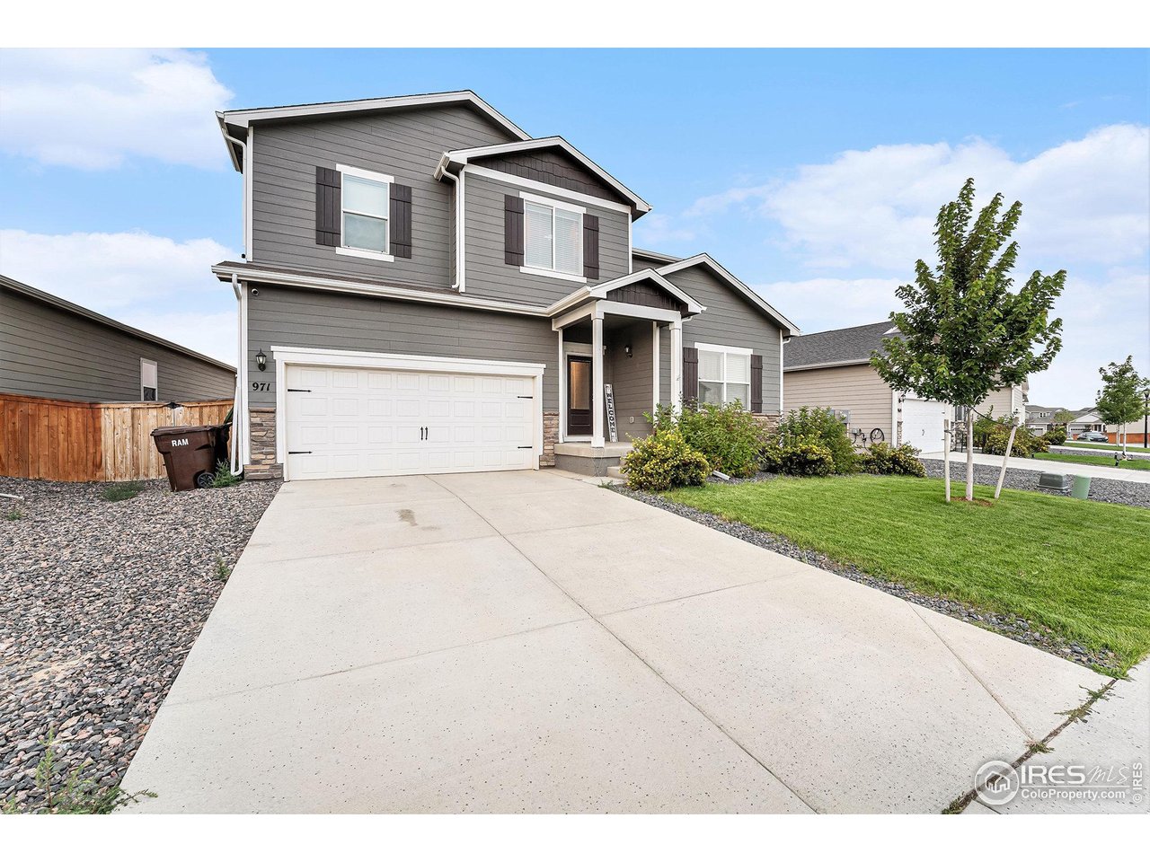 971 Ouzel Falls Road Severance, CO 80550 - Photo 2 of 16 a front view of a house with a yard and garage